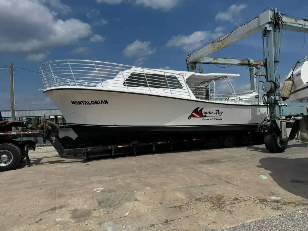 Old boat being hauled away for eco-friendly disposal