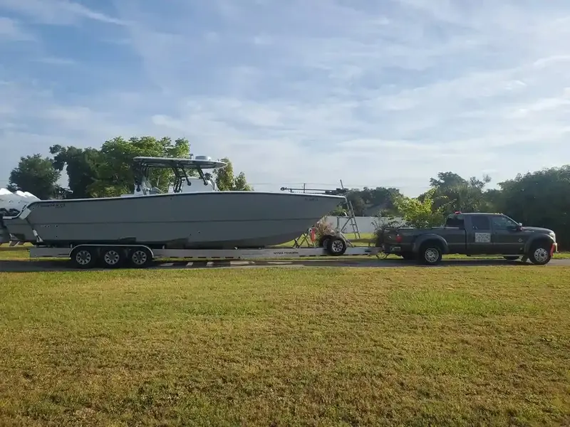 Boat being lifted onto a trailer for removal
