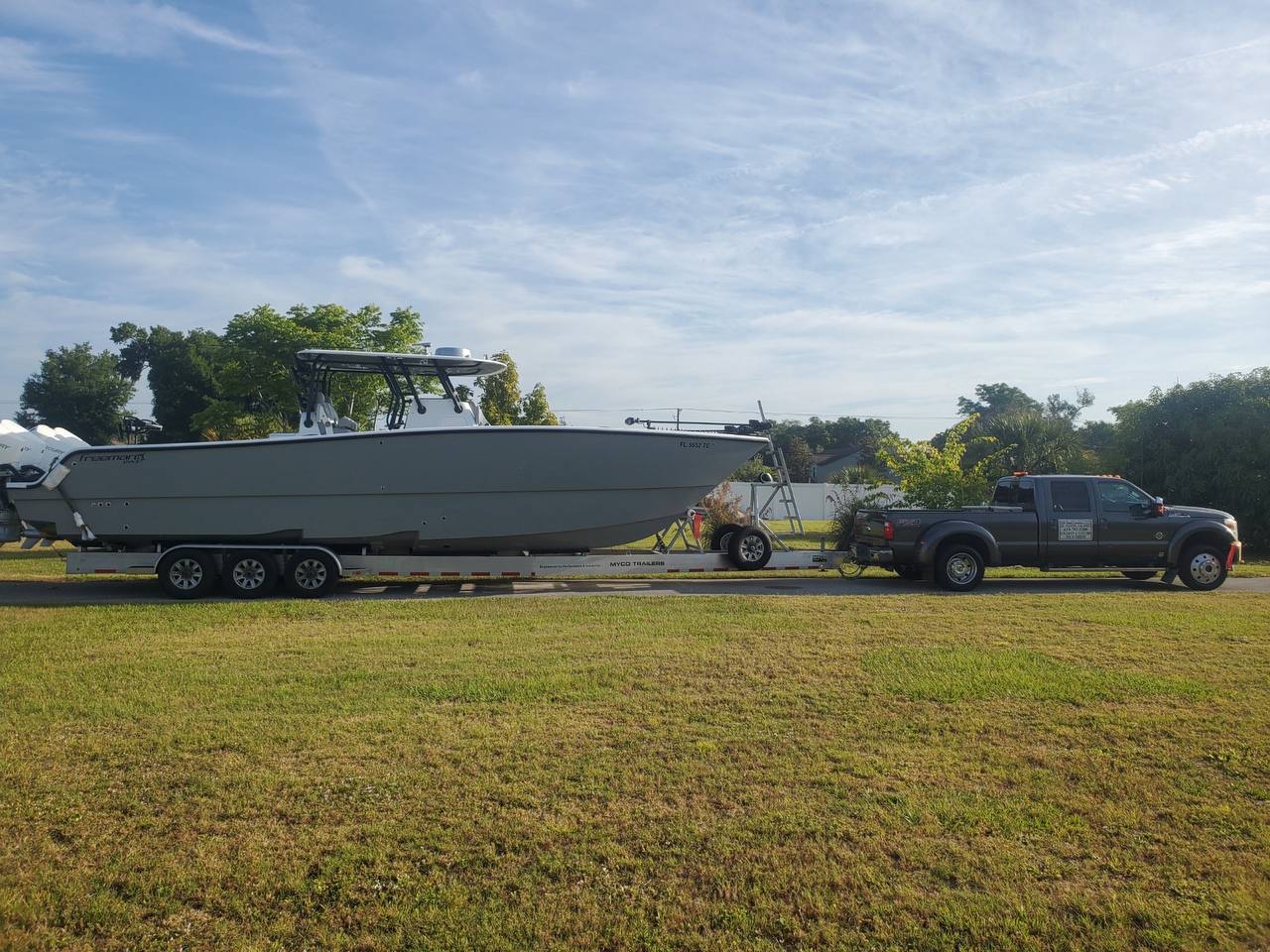 Pickup truck towing a boat on a trailer