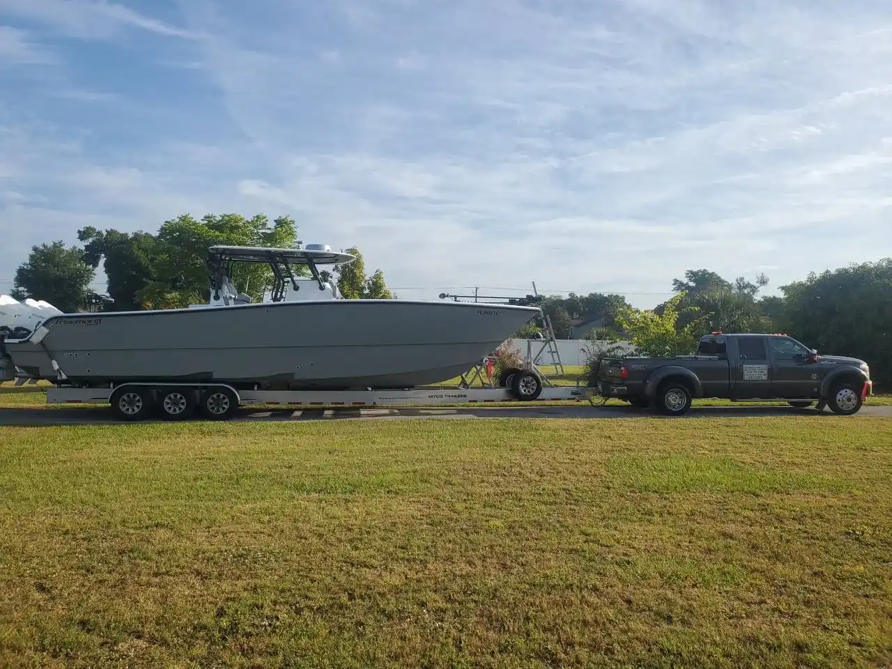Boat being lifted onto a trailer for removal