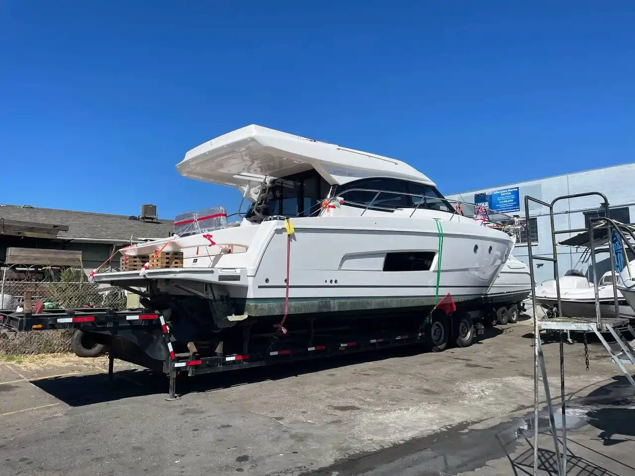 Junk boat loaded onto a trailer for disposal